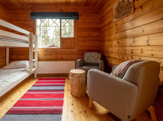 Cosy log cabin living space at Torassieppi Eco Reindeer Resort