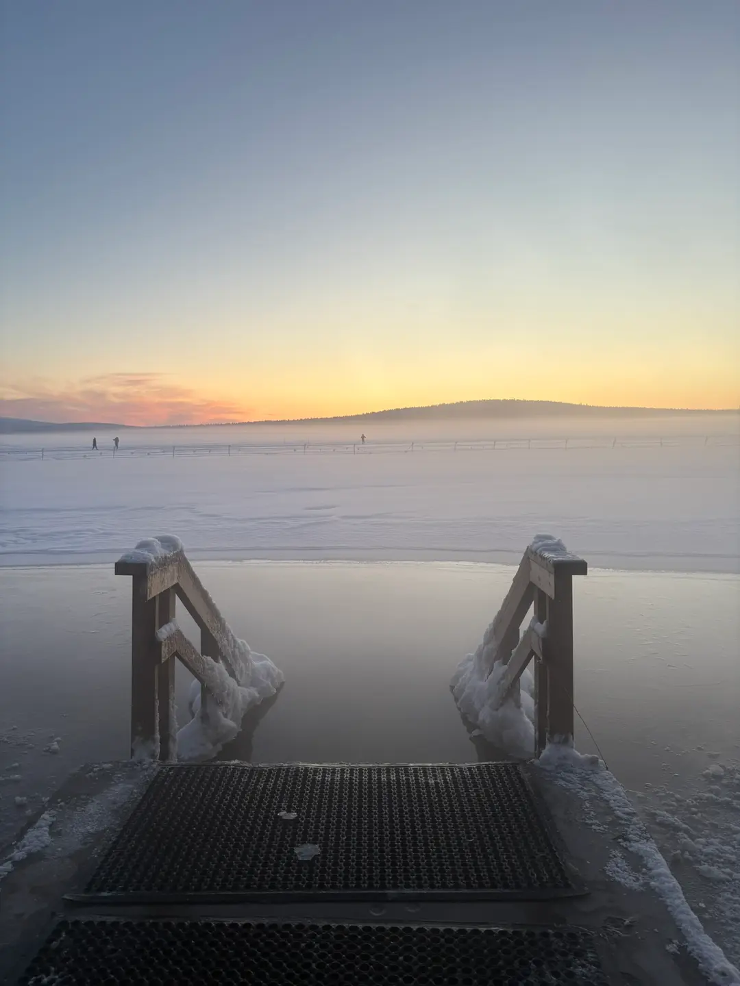 Open ice-swimming hole in the frozen surface of Lake Jerisjärvi